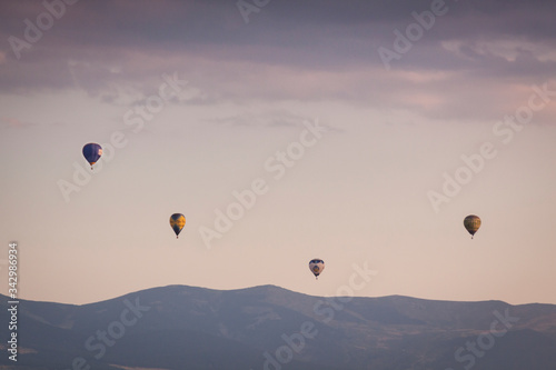 Aerostatic balloon festival over the city of Segovia, Castilla y León. Spain. Adventures with friends and family, flights. Flying at sunrise in a balloon