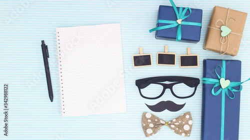 Wallpaper Mural Notebook for writing appear with blue gifts for man's special day - Stop motion  Torontodigital.ca