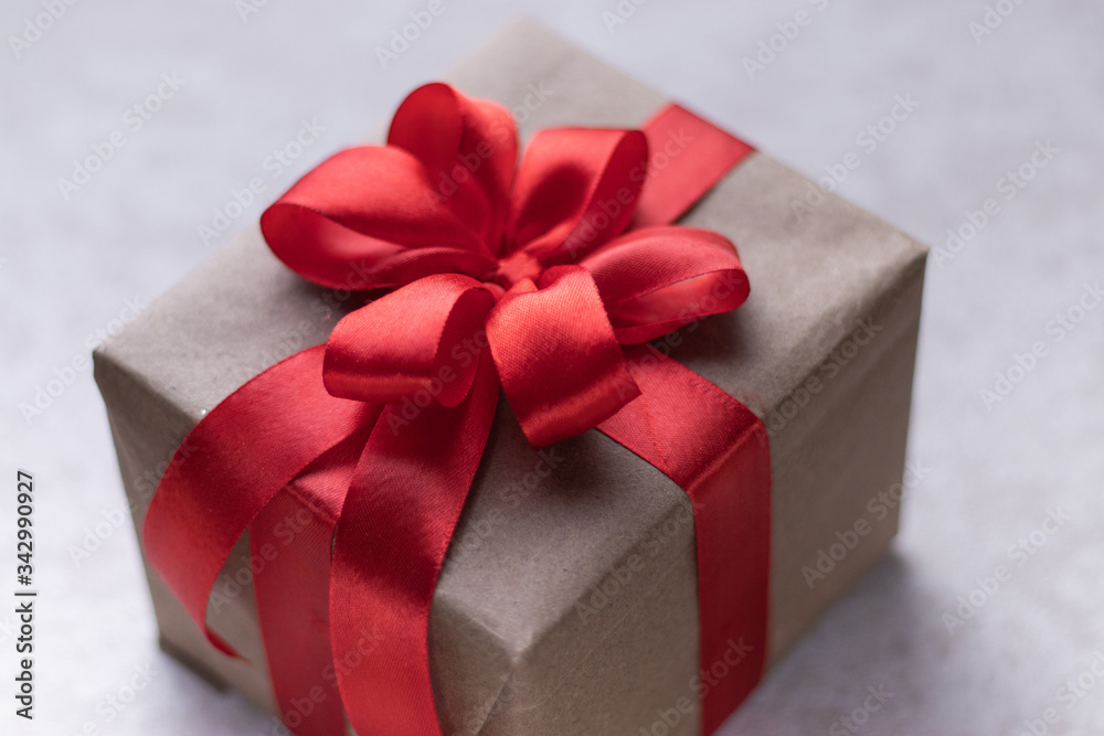 White gift box with red ribbon, black background flat lay for stock image White gift box with red ribbon, black background flat lay for stock image