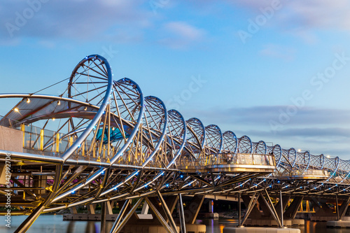 Sunset on a close view of the helix bridge over marina bay in Singapore.