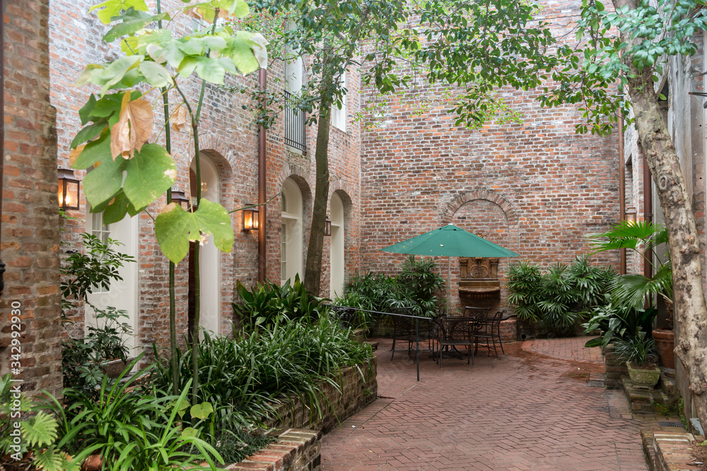 Naklejka premium Patio with brick walls and greenery