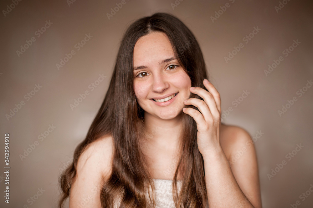 brunette girl without makeup with problem skin naked wrapped in a towel after a bath doing Spa treatments brunette girl without makeup with problem skin naked wrapped in a towel after a bath doing Spa treatments