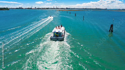 Canvas Print Aerial drone view of houseboat in Venetian lagoon, family travel cruise by vacat