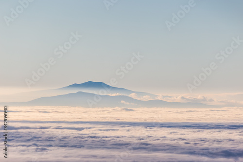 Fog filling a valley in Umbria (Italy), with layers of mountains and hills © Massimo