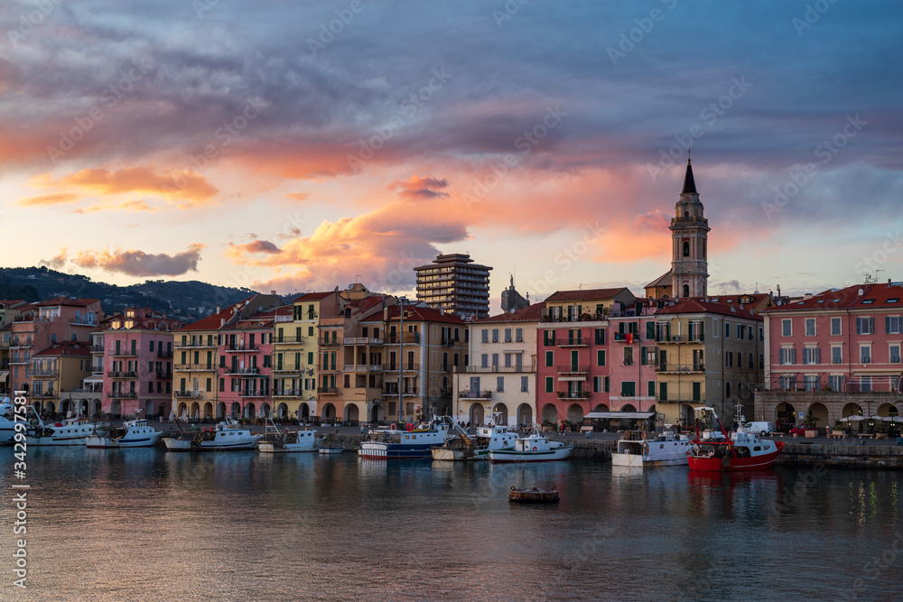 Ancient harbour with fishing boats of Imperia Oneglia in evening, Italy