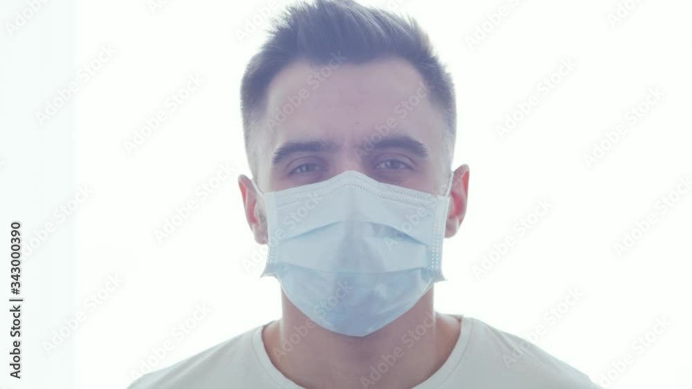 Portrait of young and emotional bearded man in protection medical mask. Covid19 pandemic, health care, medicine and coronavirus. Portrait of young and emotional bearded man in protection medical mask. Covid19 pandemic, health care, medicine and coronavirus.