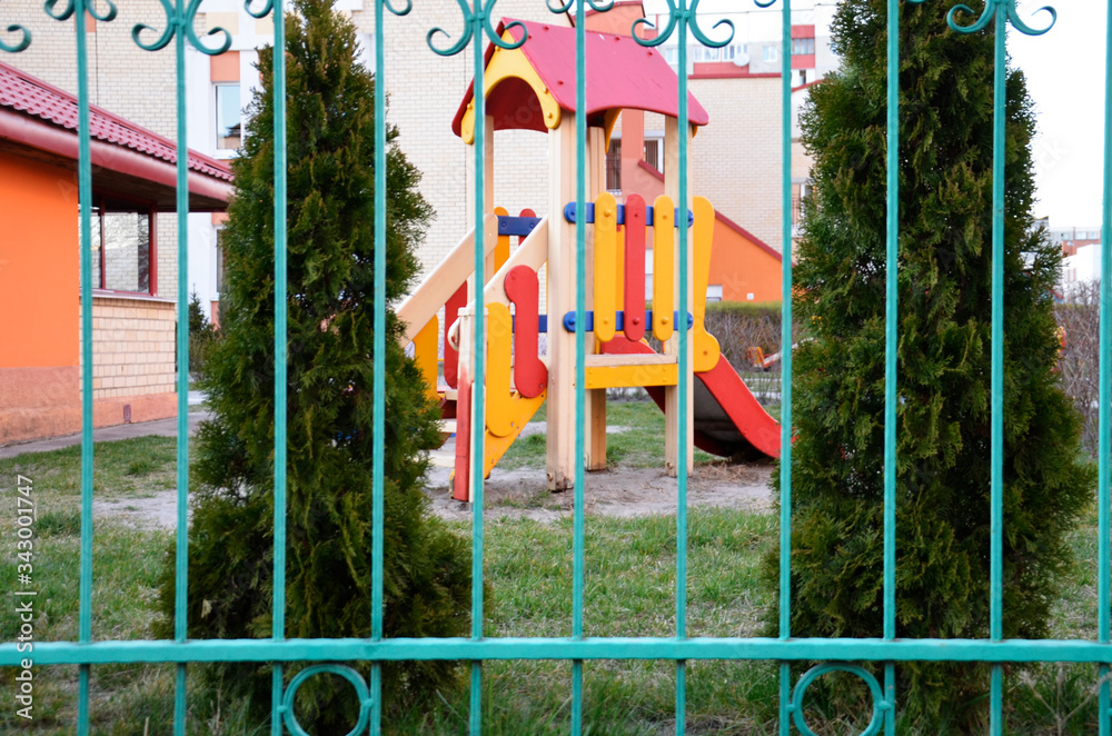 Private Playground behind a green fence.
