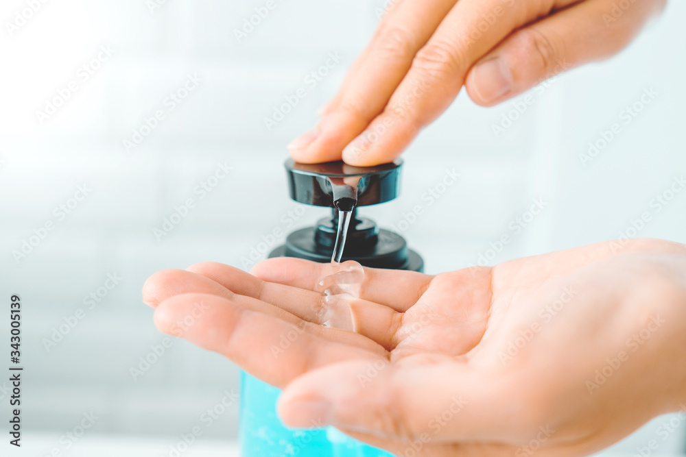 Woman hands using alcohol gel clean wash hand sanitizer anti virus bacteria Hygiene and Healthcare concept to Covid-19 virus prevention at Home Woman hands using alcohol gel clean wash hand sanitizer anti virus bacteria Hygiene and Healthcare concept to Covid-19 virus prevention at Home