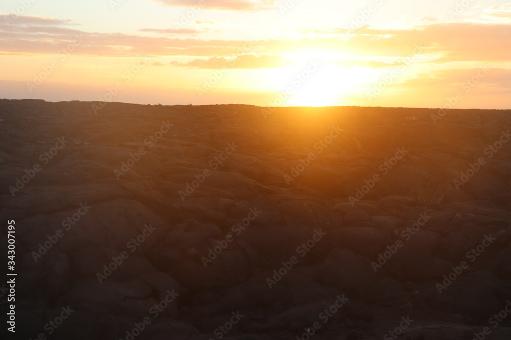 Naklejka premium Sunset over beautiful lava stone landscape