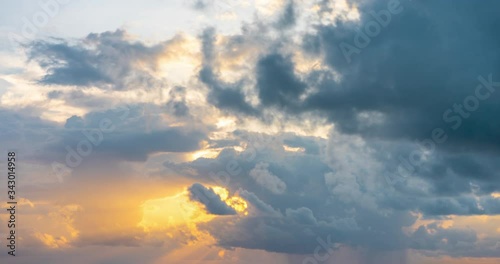 Timelapse of rising sun on the sky with clouds