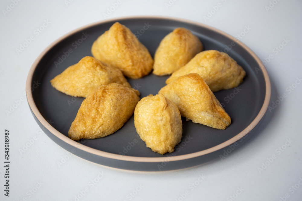 Korean style inari sushi which is fried tofu stuffed with rice Korean style inari sushi which is fried tofu stuffed with rice