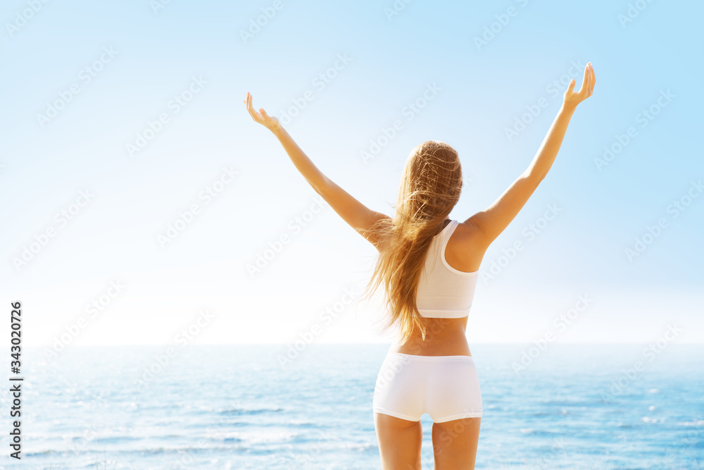 Woman Rear Back View, Raised Arms Up on Sky Sea Landscape View, Girl in White Sexy Sporty Clothing Woman Rear Back View, Raised Arms Up on Sky Sea Landscape View, Girl in White Sexy Sporty Clothing