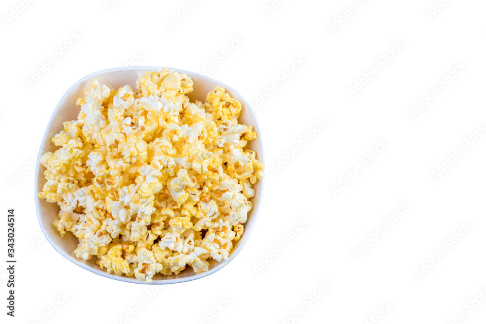 Popcorn in a white bowl top view. Fresh pop corn in white blow isolated on white background. White Salty popcorn a full bowl.