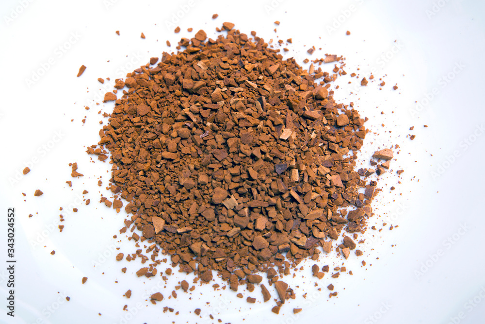Instant coffee granules in a white mug
Instant coffee granules in a white mug