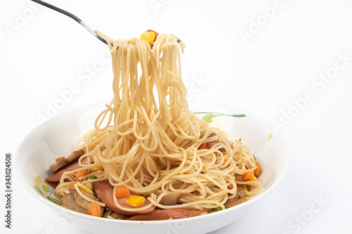 Homemade delicious fried spaghetti on White Background.  