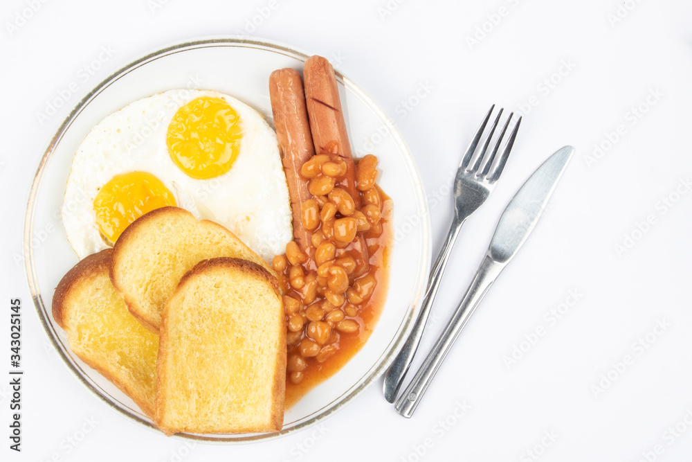 English breakfast with fried eggs, sausages, beans and toasts on white background. English breakfast with fried eggs, sausages, beans and toasts on white background.