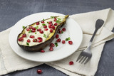 baked eggplant with cashew sauce and pomegranate