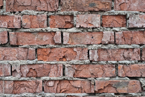 old red brick wall with crumbling stones