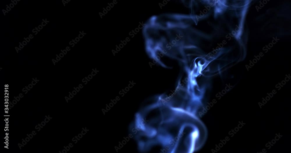 Incense stick with smoke isolated on black background Incense stick with smoke isolated on black background