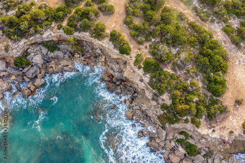 View from above of the sea bay. Waves, rocks and beautiful trees on the coast. Cyprus, Akamas Peninsula in the West of Cyprus © Alex Shestakov