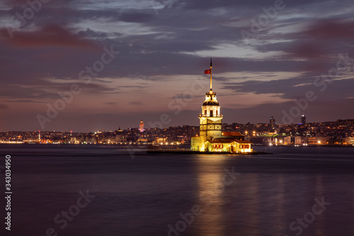 The famous Maiden's Tower or the Leanders Tower (Kiz Kulesi in Turkish) standing in the middle of the Bosphorus, Istanbul, Turkey photo