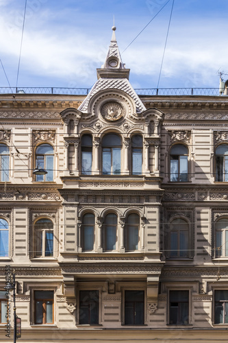 Vintage architecture facade building in Pseudo-Russian style. Front view close up. Electric wires.