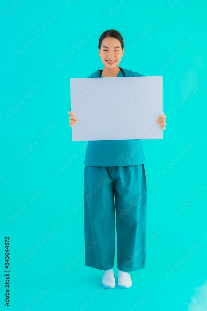 Portrait beautiful young asian doctor woman with empty paper board for copy space Portrait beautiful young asian doctor woman with empty paper board for copy space