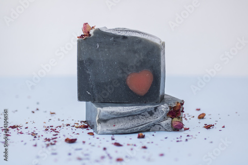 Photos Handmade grey natural soap with a heart inlay.