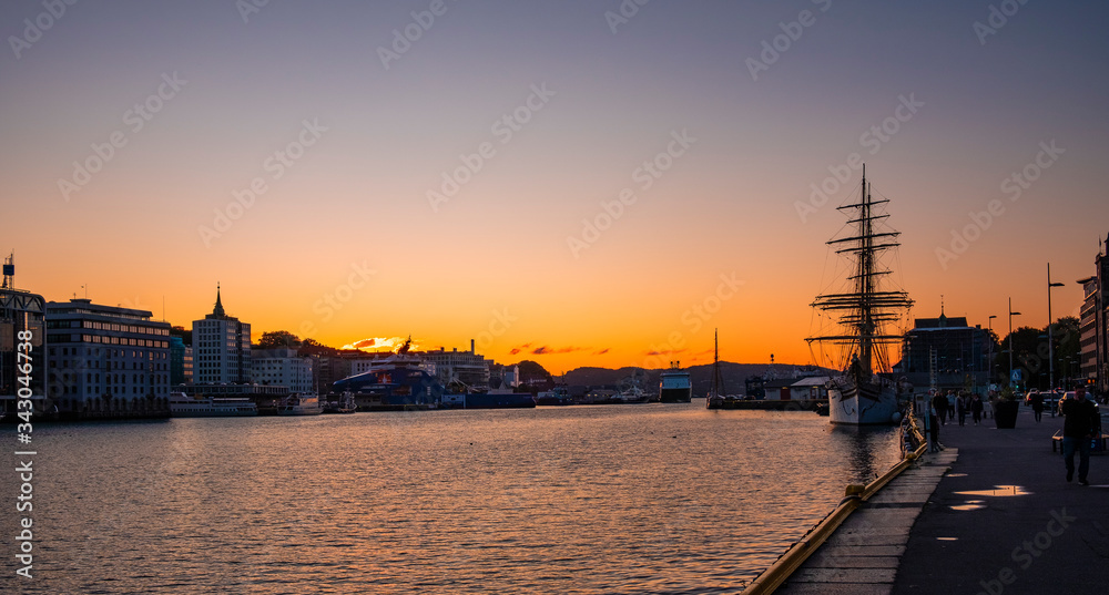 Bergen, Norway - Sunset over Bergen Vagen harbor - Bergen Havn - with historic Bryggen district and of Strandsiden quarter