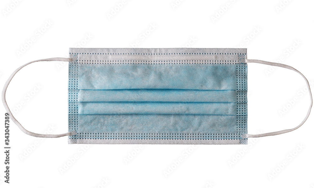 Light blue disposable medical face mask with rubber bands isolated on white background. Light blue disposable medical face mask with rubber bands isolated on white background.