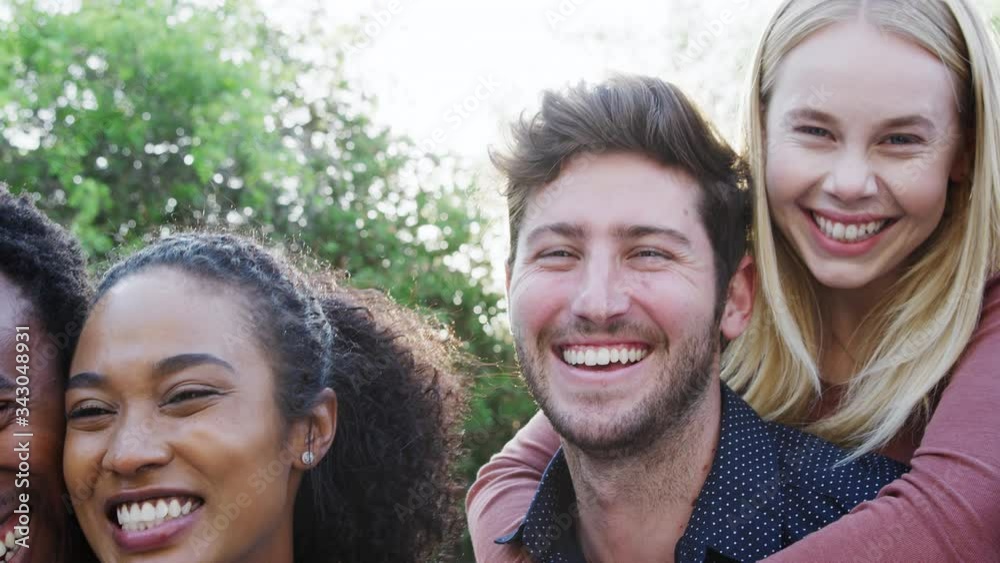 Portrait Of Group Of Multi-Cultural Friends Enjoying Outdoor Summer Garden Party Portrait Of Group Of Multi-Cultural Friends Enjoying Outdoor Summer Garden Party