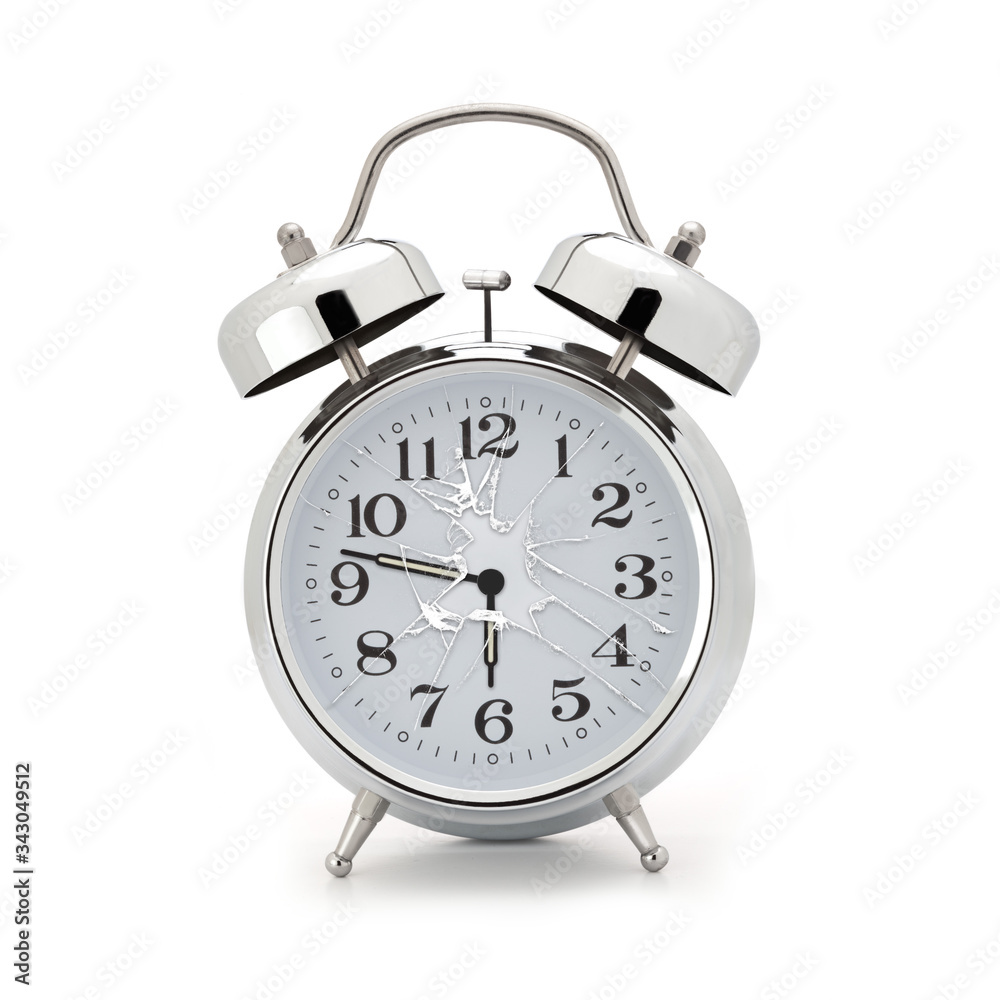 Broken alarm clock on white background Broken alarm clock on white background