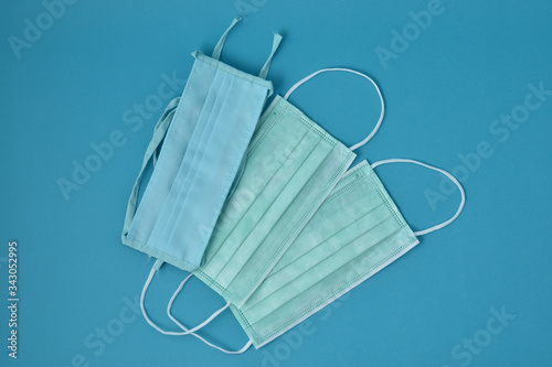 Ear-loop face mask 3 ply, Safety masks on blue background.Medical mask for protection against flu and other diseases and prevention of the spread of virus