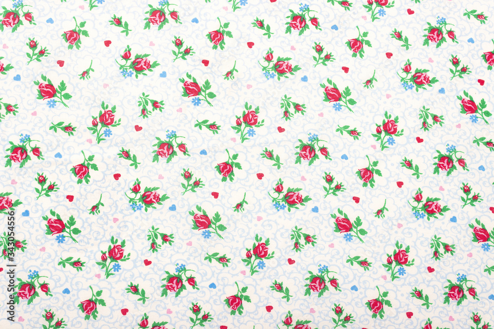 Beautiful calico texture with embroidered flowers on a calm plain background Beautiful calico texture with embroidered flowers on a calm plain background