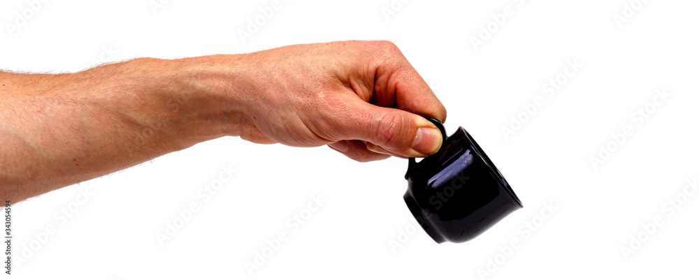 Male hand holding coffee cup isolated on white background. Minimalistic concept. Male hand holding coffee cup isolated on white background. Minimalistic concept.