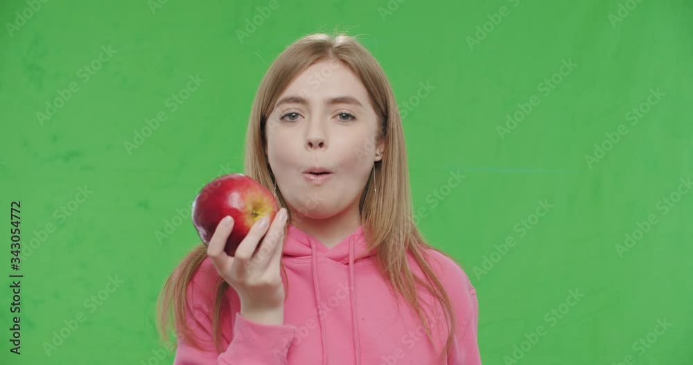 woman biting big fresh red apple woman biting big fresh red apple