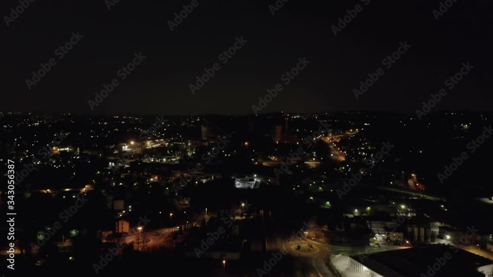 Aerial view of industrial area at night, with view on industry, highway and downtown Aerial view of industrial area at night, with view on industry, highway and downtown