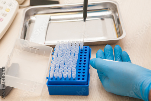 Conducting tests in a medical laboratory.