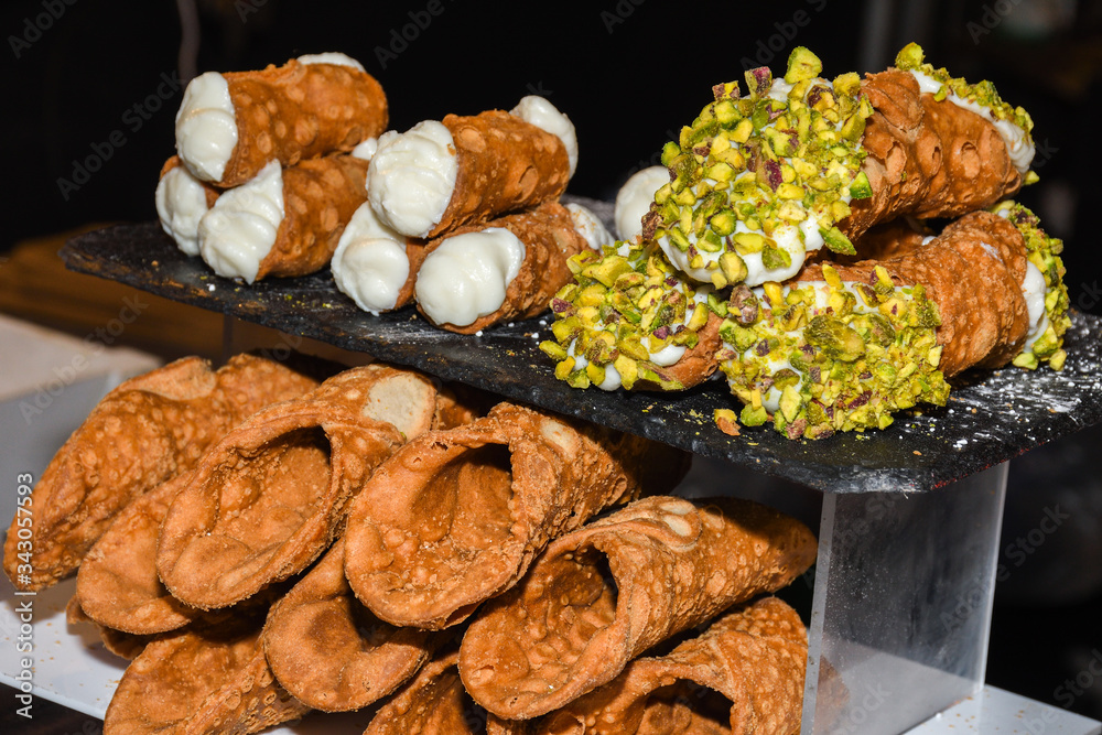 Cannoli consist of tube-shaped shells of fried pastry dough Stock Photo ...