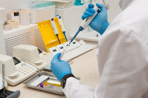 Conducting tests in a medical laboratory.