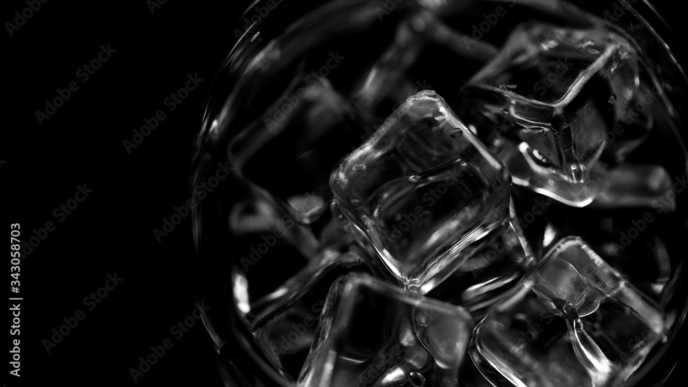 Closeup pouring clean fresh Water in a Glass with splash and bubbles, isolated on Black background. Ice, bubbles and splash. Cold tonic Mineral water. Healthy lifestyle. Living water. Drinking water. Closeup pouring clean fresh Water in a Glass with splash and bubbles, isolated on Black background. Ice, bubbles and splash. Cold tonic Mineral water. Healthy lifestyle. Living water. Drinking water.