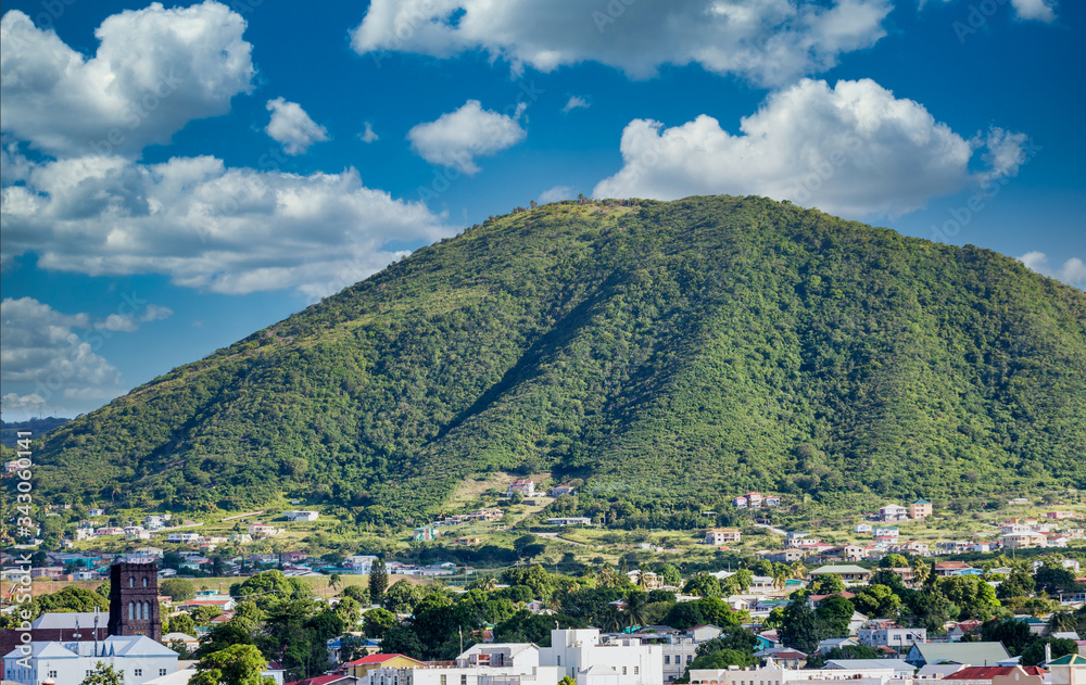 Green hill overlooking port town on St Kitts