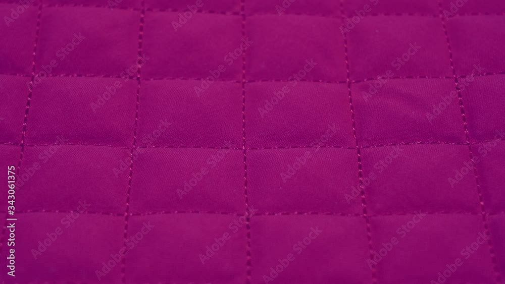 Closeup view video of bright pink quilted texture of fabric. Closeup view video of bright pink quilted texture of fabric.