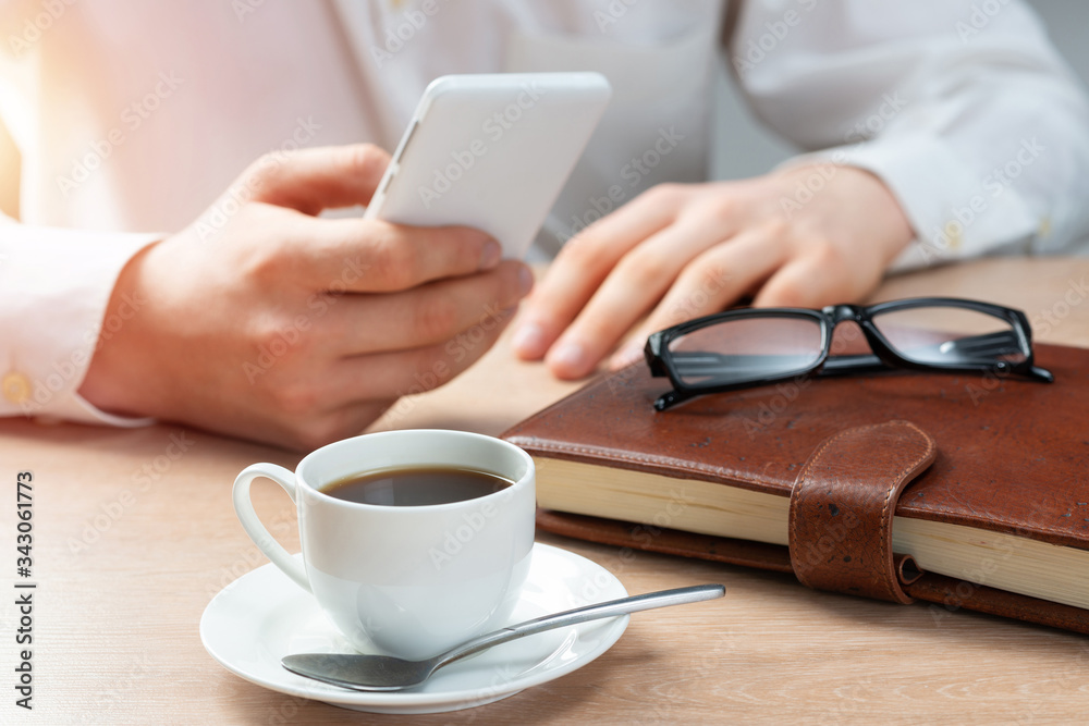 Man in white shirt using smartphone Man in white shirt using smartphone