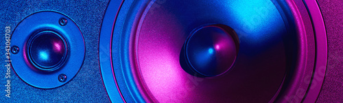 Sound audio speaker with neon lights, long banner. Dynamic monitor close up. Creative backgroound