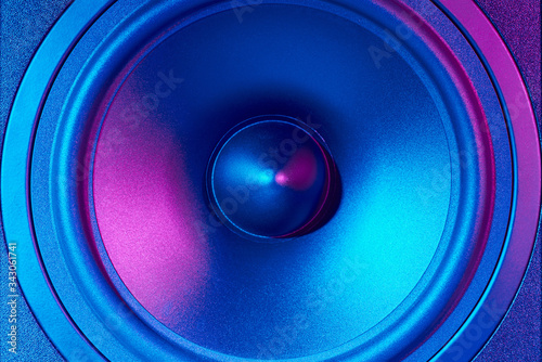 Sound audio speaker with neon lights. Dynamic monitor close up. Creative backgroound photo