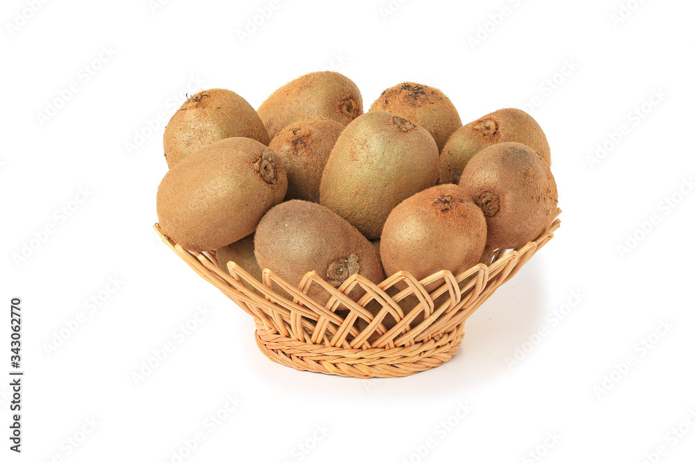 Delicious kiwi in wicker basket isolated on white Delicious kiwi in wicker basket isolated on white