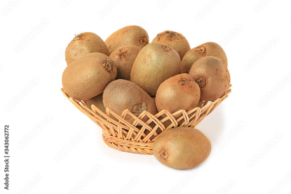 Delicious kiwi in wicker basket and a whole kiwi isolated on white Delicious kiwi in wicker basket and a whole kiwi isolated on white