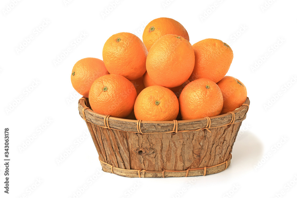 Oranges in a wooden basket isolated on white Oranges in a wooden basket isolated on white