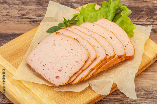 Boiled pork sausage over board